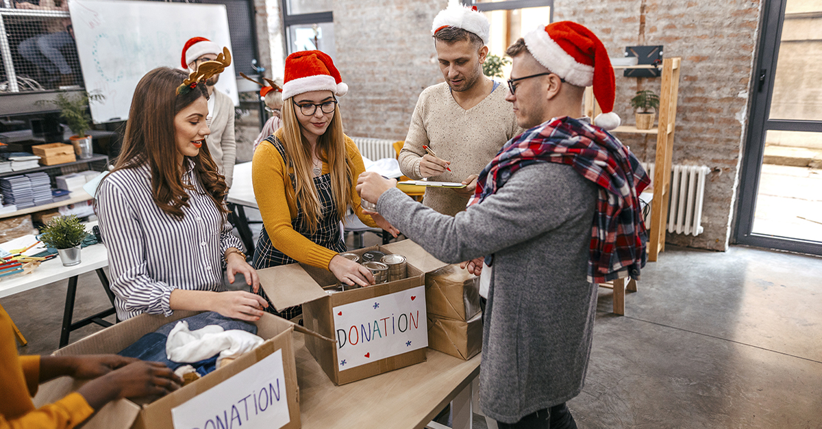 A team assembles gifts for charity